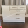 White dresser with multiple drawers against a neutral background