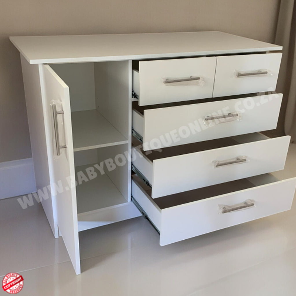 White dresser with multiple drawers and open shelf on a neutral background