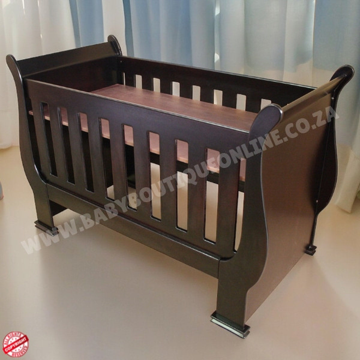 2in1 Sleigh wooden Cot Burgundy in a baby room with wooden floors