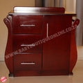 Wooden dresser with three drawers on a beige floor and wall.