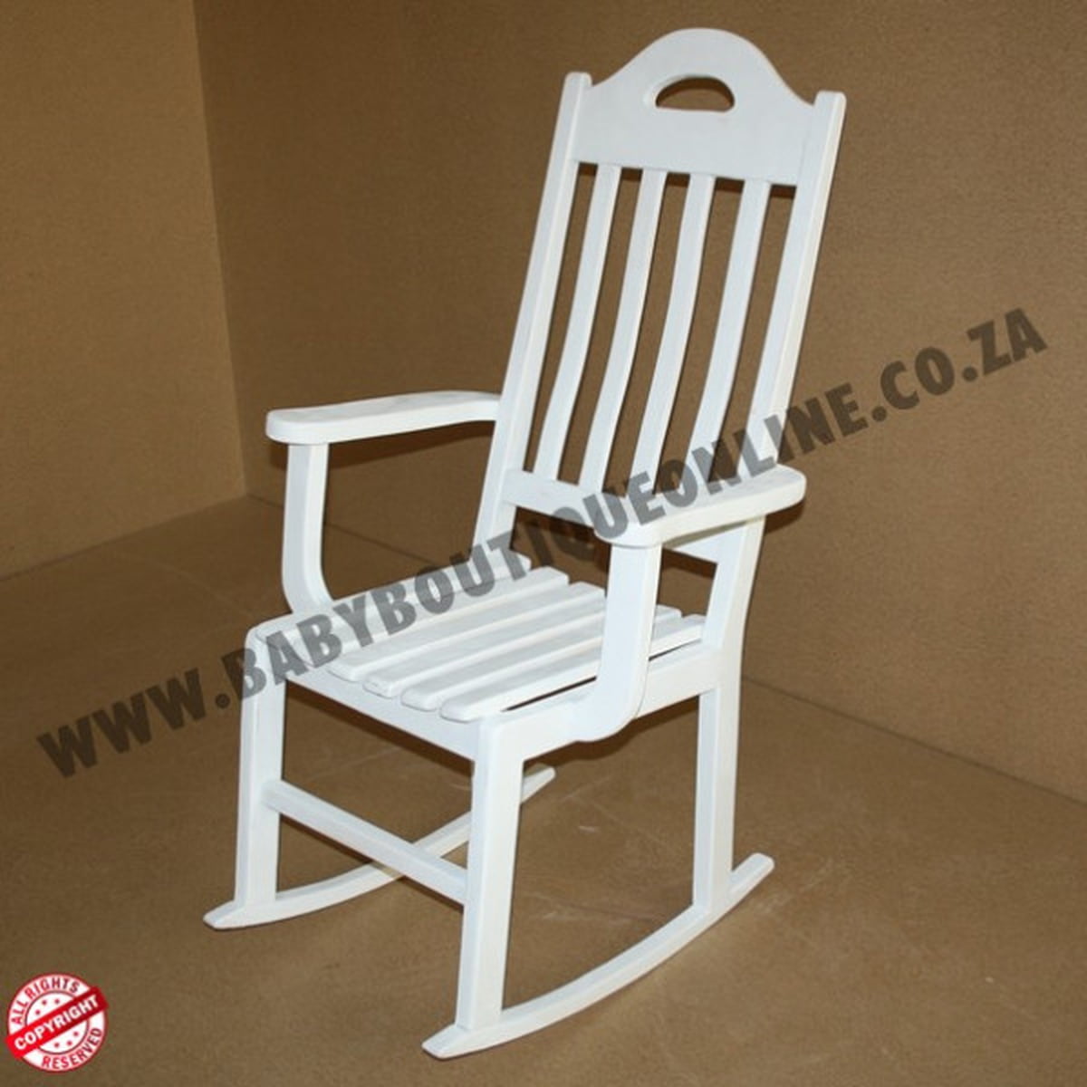 White rocking chair on a brown background with visible branding.