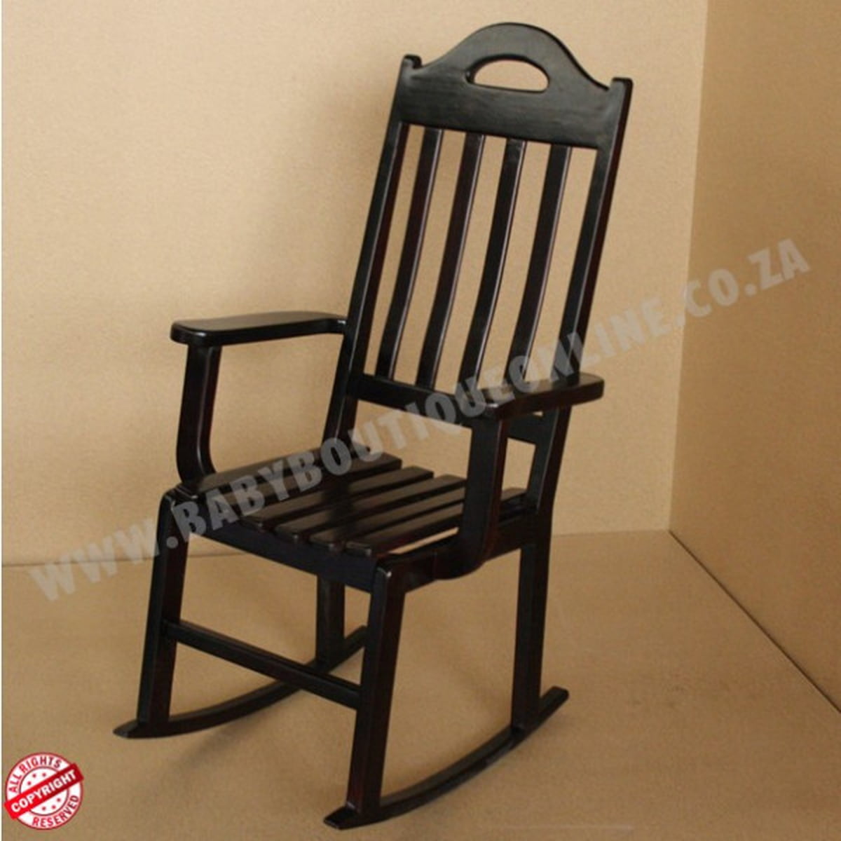 Black wooden rocking chair on a beige background with 'www.babyboutiquefurniture.co.za' text.