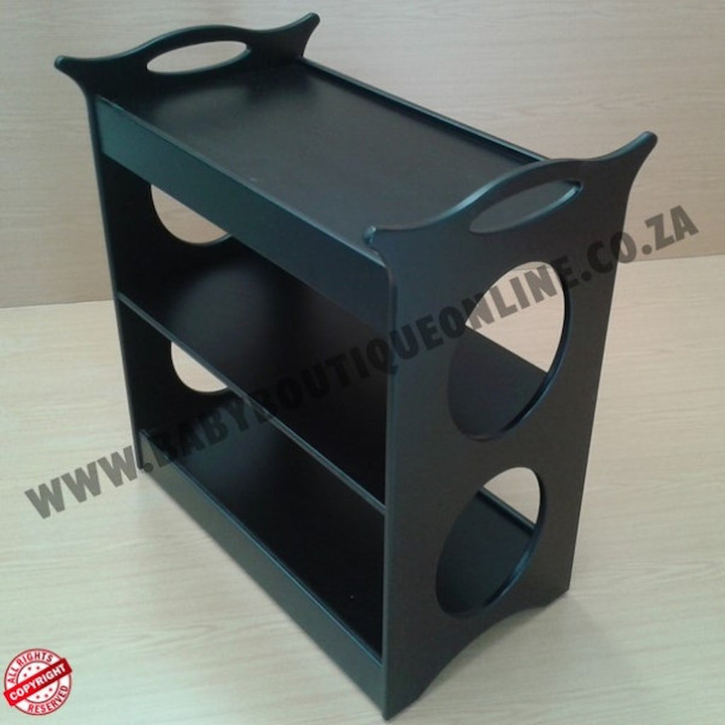 Black three-tiered shelf on a light wooden surface with 'Wabi Sabi Boutique Online' branding.