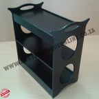 Black three-tiered shelf on a light wooden surface with 'Wabi Sabi Boutique Online' branding.