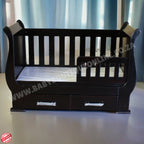 SleighCot with Drawers Burgundy with drawers against a white curtain background