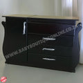 Black dresser with wooden top on a white background