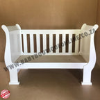3-in-1 Sleigh Cot and Co-Sleeper White baby crib on a wooden floor with white curtains in the background