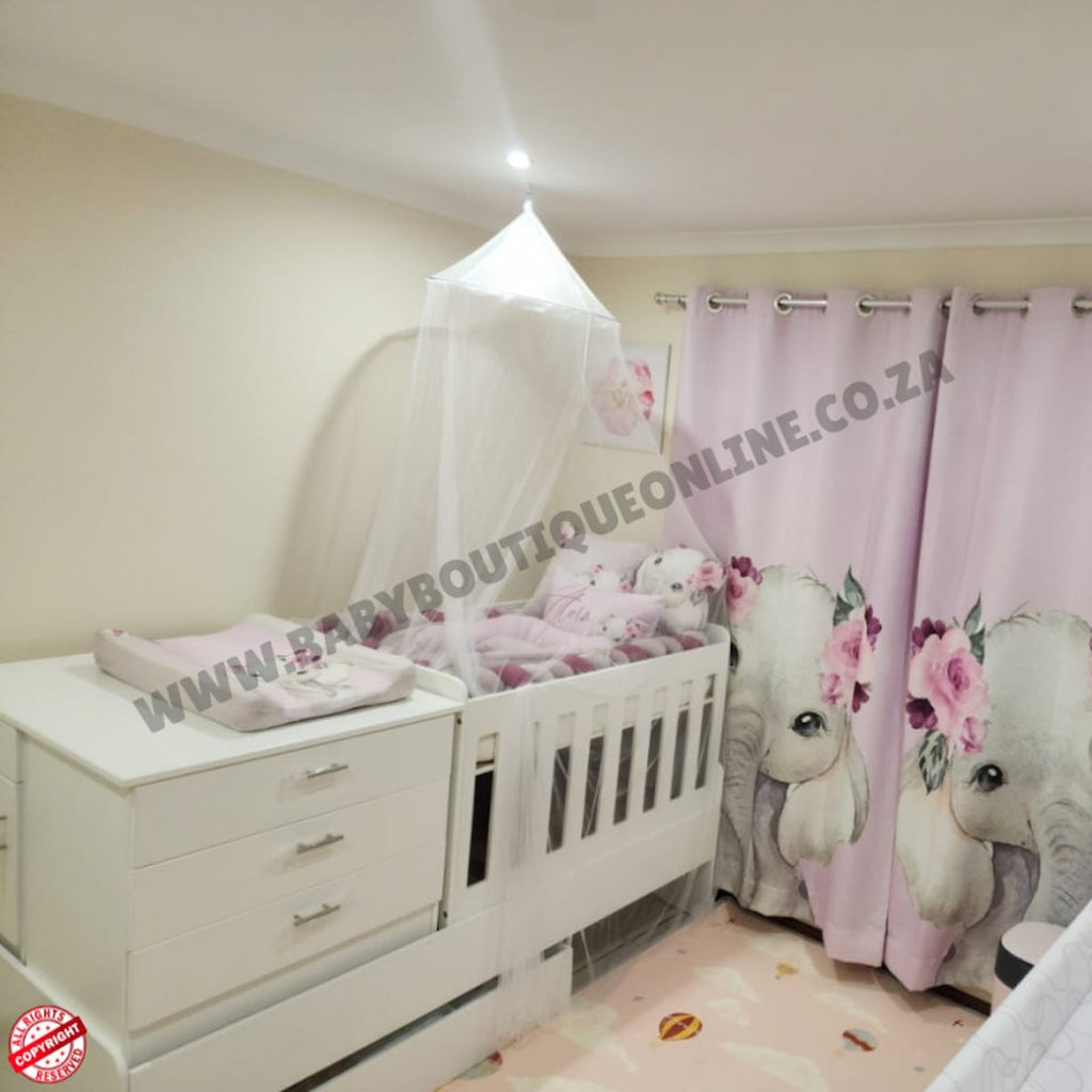 Babybedroominabox5-in-1Cot Baby crib with canopy and elephant-themed curtain in a nursery setting.