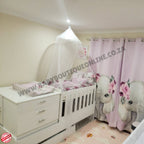 Babybedroominabox5-in-1Cot Baby crib with canopy and elephant-themed curtain in a nursery setting.