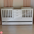 BabyBoutiqueTwinCot in a baby room with wooden floors