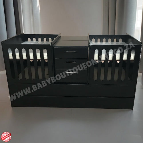BabyBoutiqueTwinCotBurgundy  with drawers on a white surface, brand 'Baby Boutique' visible.