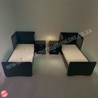 Twin beds with nightstands in a minimalistic room.