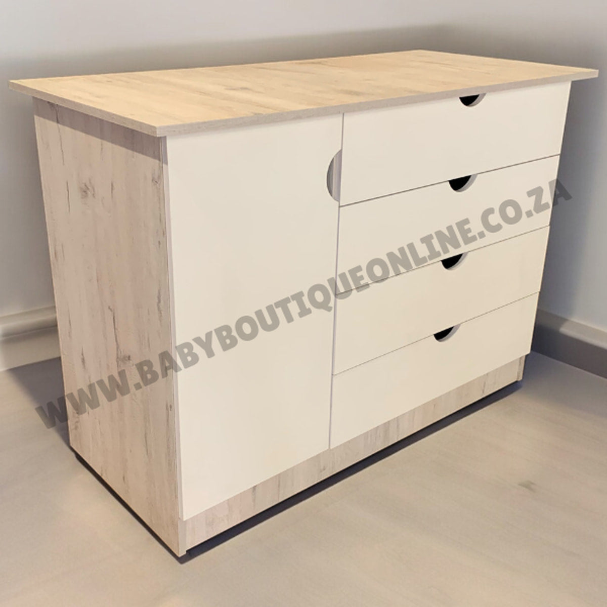 Wooden dresser with multiple drawers on a plain floor and wall.