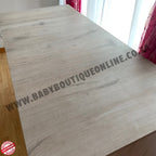 Wooden surface with 'www.babyboutiqueonline.com' branding.