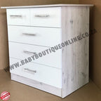 White dresser with grayish wood finish on a brown background