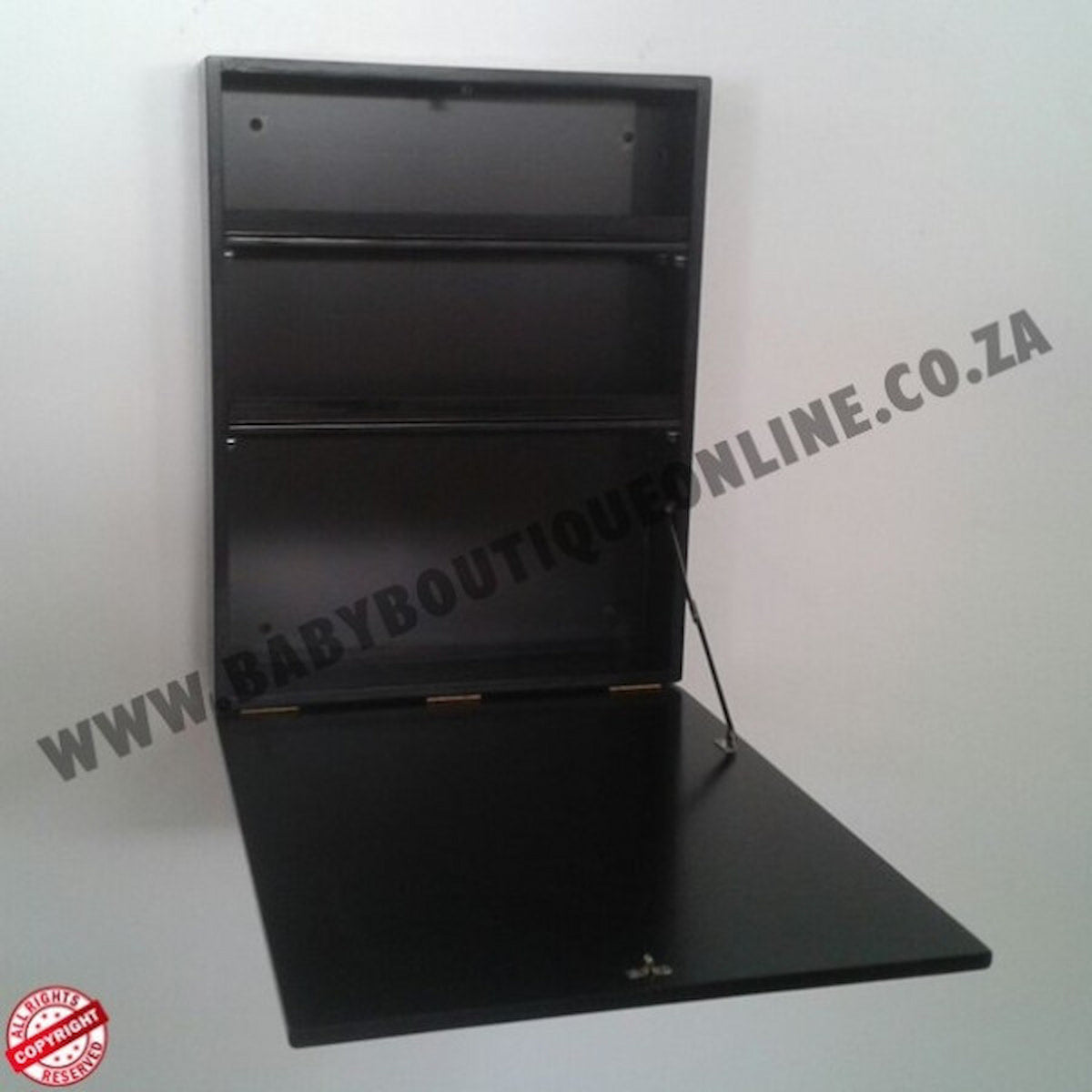 Black wall-mounted shelf on a white background with 'www.babyboutiqueonline.co.za' text.