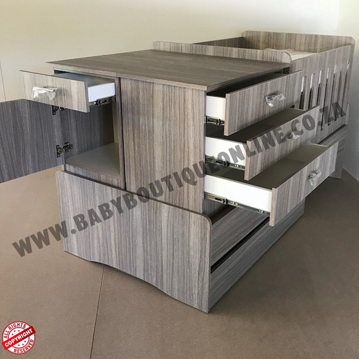 BabyBedroominabox5-in-1Cot Wooden crib with multiple drawers and a small bed on top, branded 'Baby Boutique Online'.