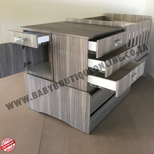 BabyBedroominabox5-in-1Cot Wooden crib with multiple drawers and a small bed on top, branded 'Baby Boutique Online'.