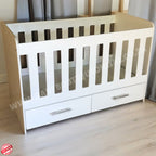 WoodenCotwithDrawerSupawoodMDF with drawers on a wooden floor against a gray curtain background