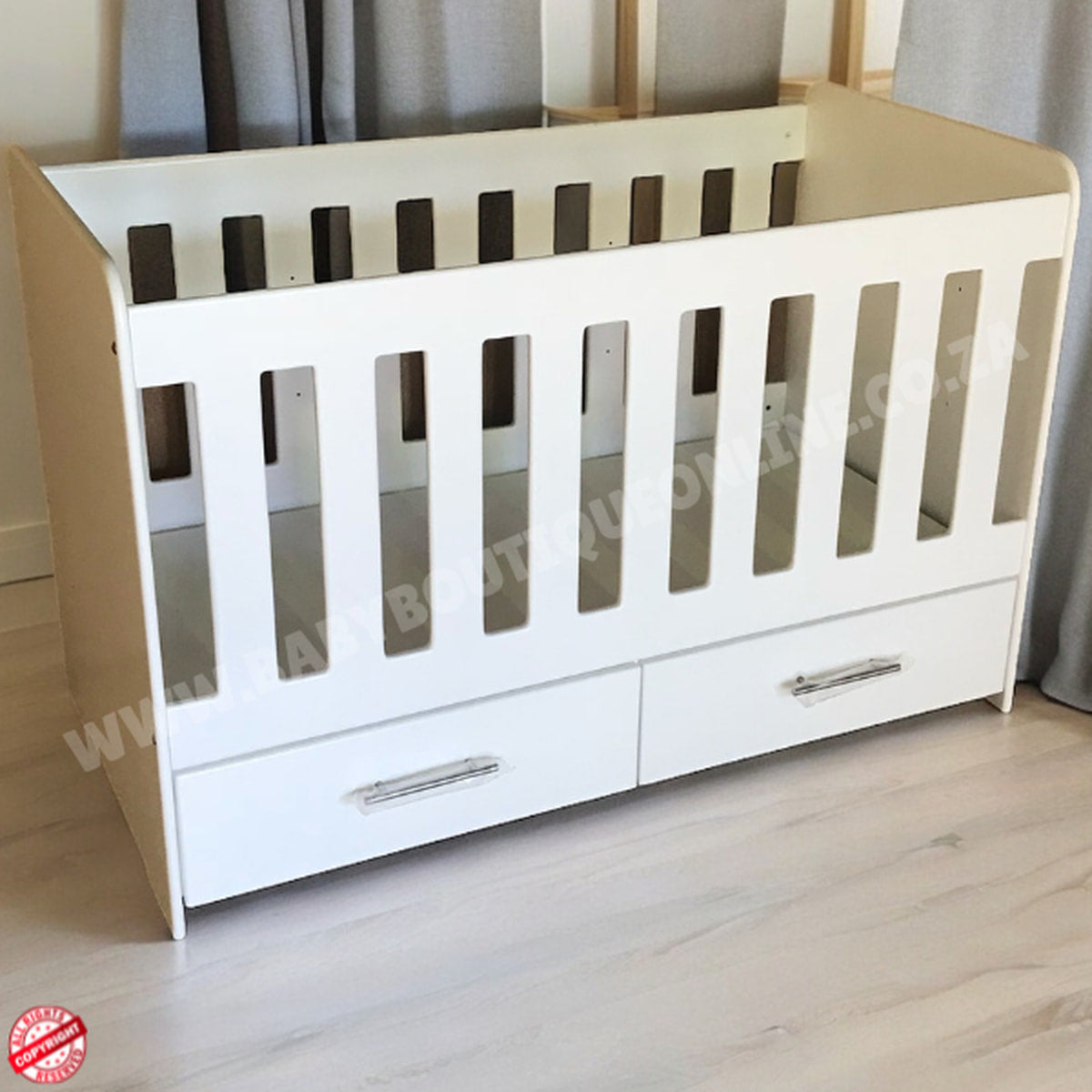 WoodenCotwithDrawerSupawoodMDF with drawers on a wooden floor against a gray curtain background