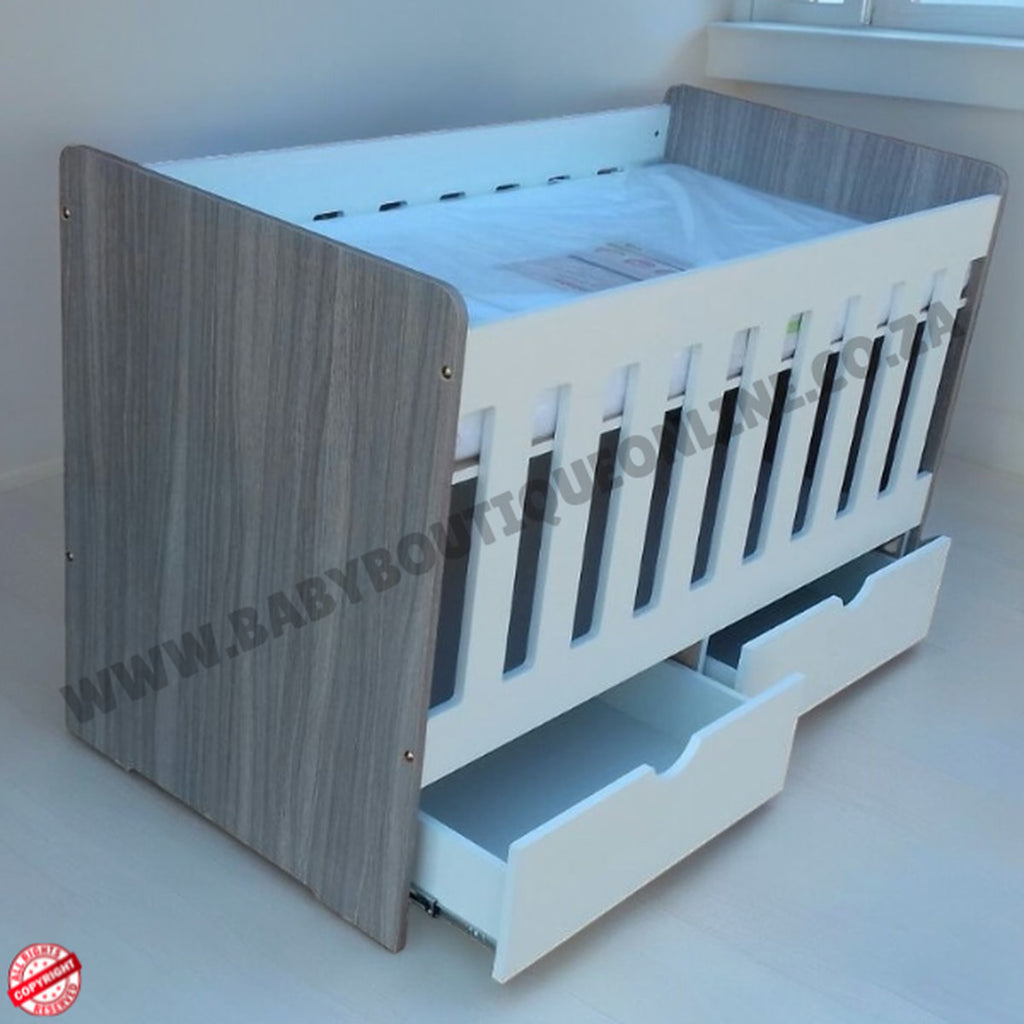 LargeWoodenCotwithSplitDrawerWhite_Cascade with gray and white design, featuring a drawer at the bottom.