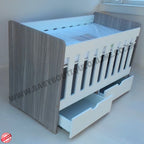 LargeWoodenCotwithSplitDrawerWhite_Cascade with gray and white design, featuring a drawer at the bottom.