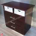 Wooden dresser with drawers and baskets on a light wooden floor.