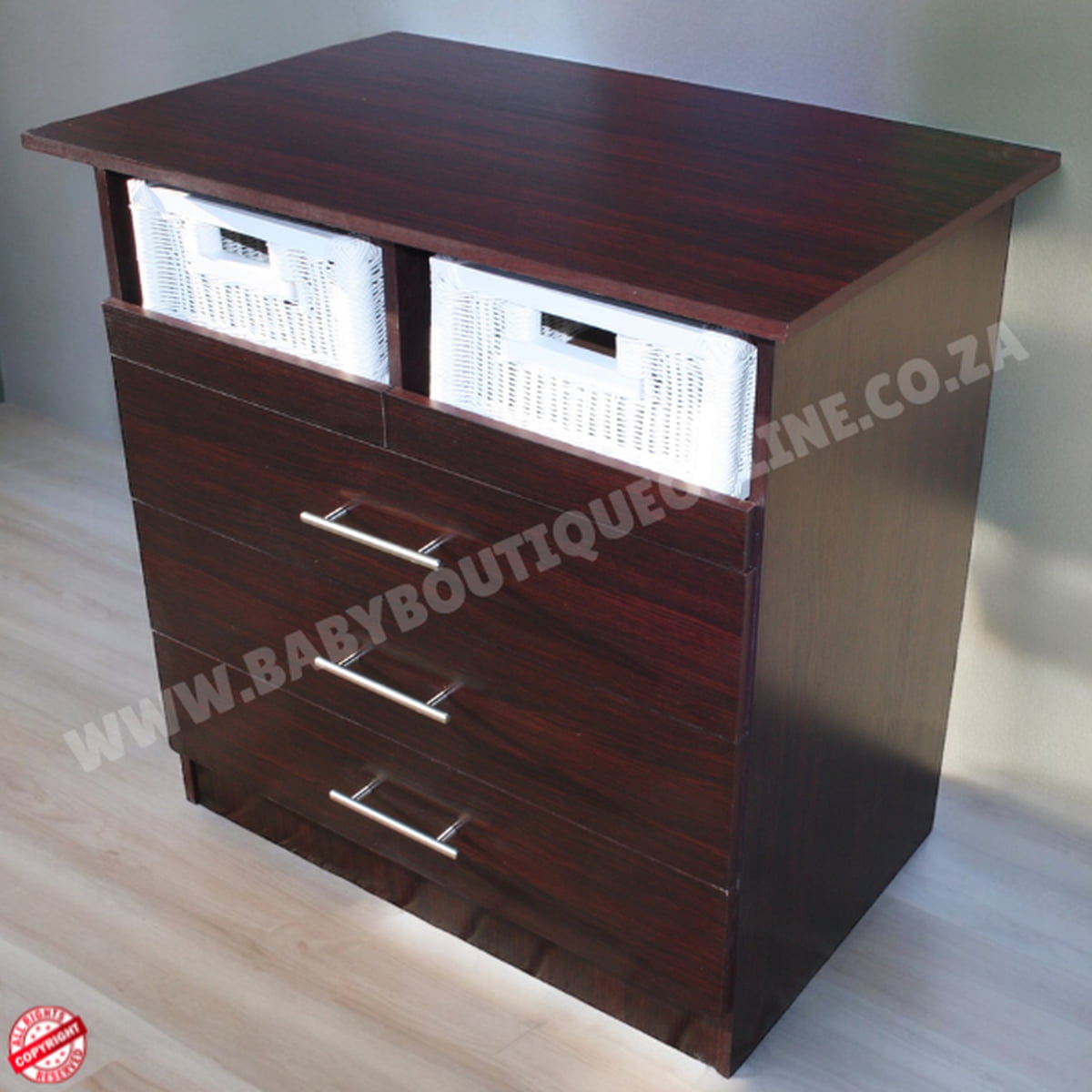 Wooden dresser with drawers and baskets on a light wooden floor.