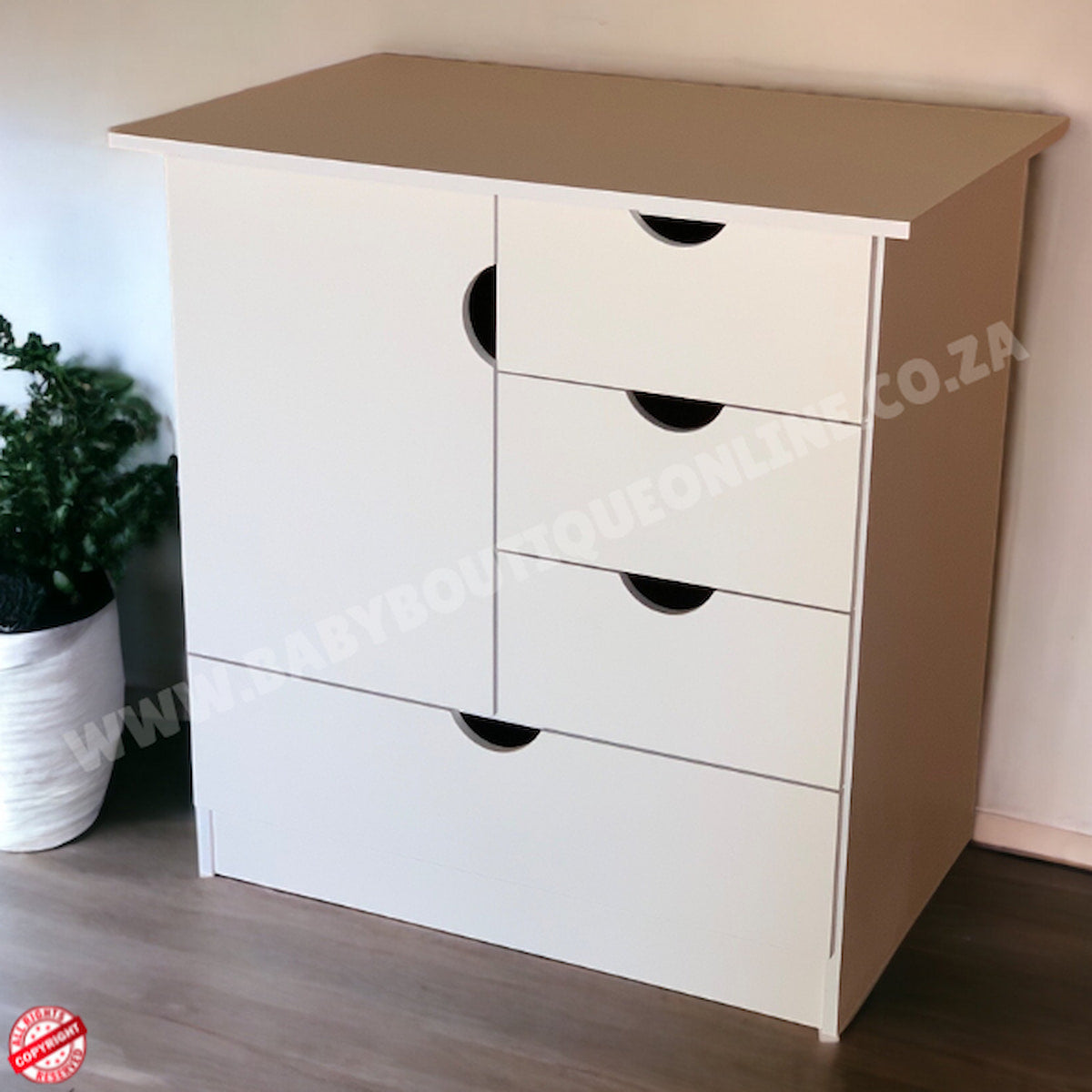 White dresser with four drawers against a neutral wall.