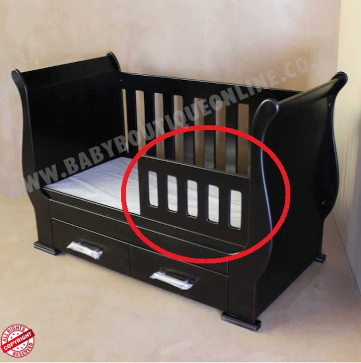 Black baby crib with a red circle highlighting a small defect on the side.