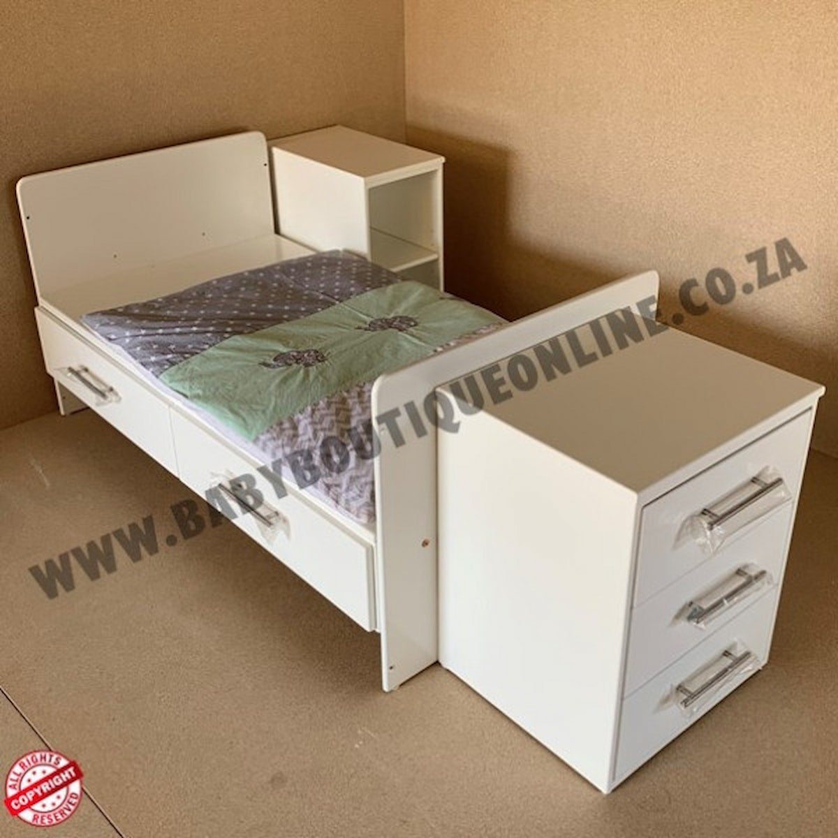 White bed with desk combination in a room with beige walls and floor.