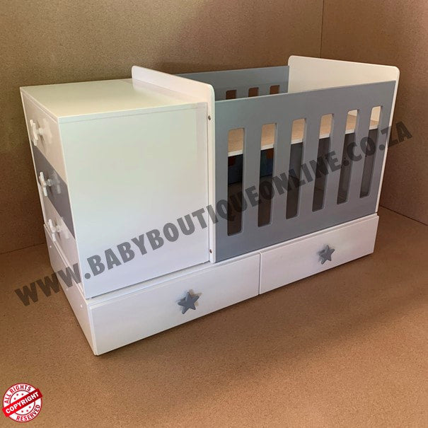 BabyBedroominabox4-in-1ToddlerCot Children's white and gray crib with star designs on a brown background