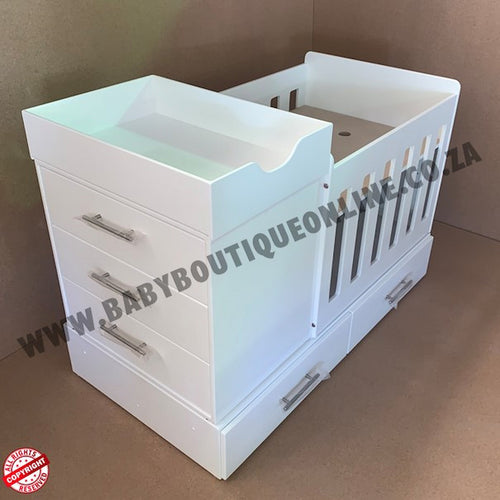 BabyBedroominabox4-in-1 White baby changing table with drawers on a brown background
