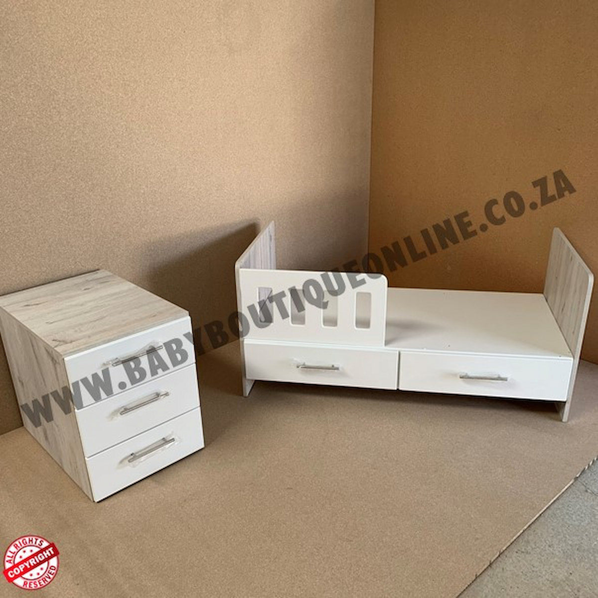 4-in-1-ChestofDrawers White crib and nightstand set on a brown floor with 'www.babyboutiqueonline.co.za' branding.
