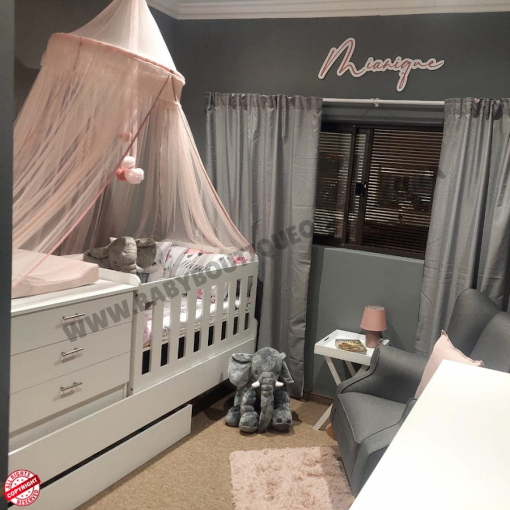 Nursery room with Bedroominabox-5-in-1Cot crib, canopy, and decorative elements.