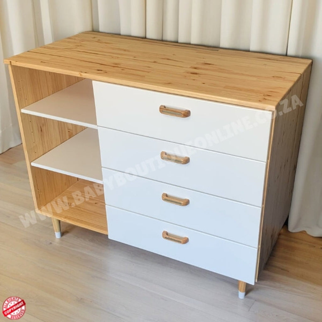 Wooden cabinet with white drawers and wooden top on a light wooden floor.