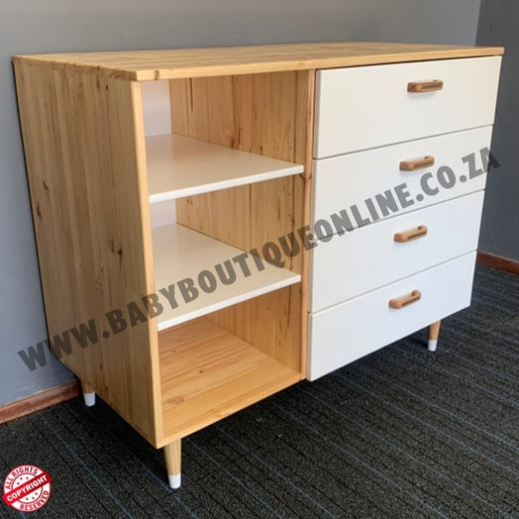 Wooden cabinet with white drawers against a gray wall.
