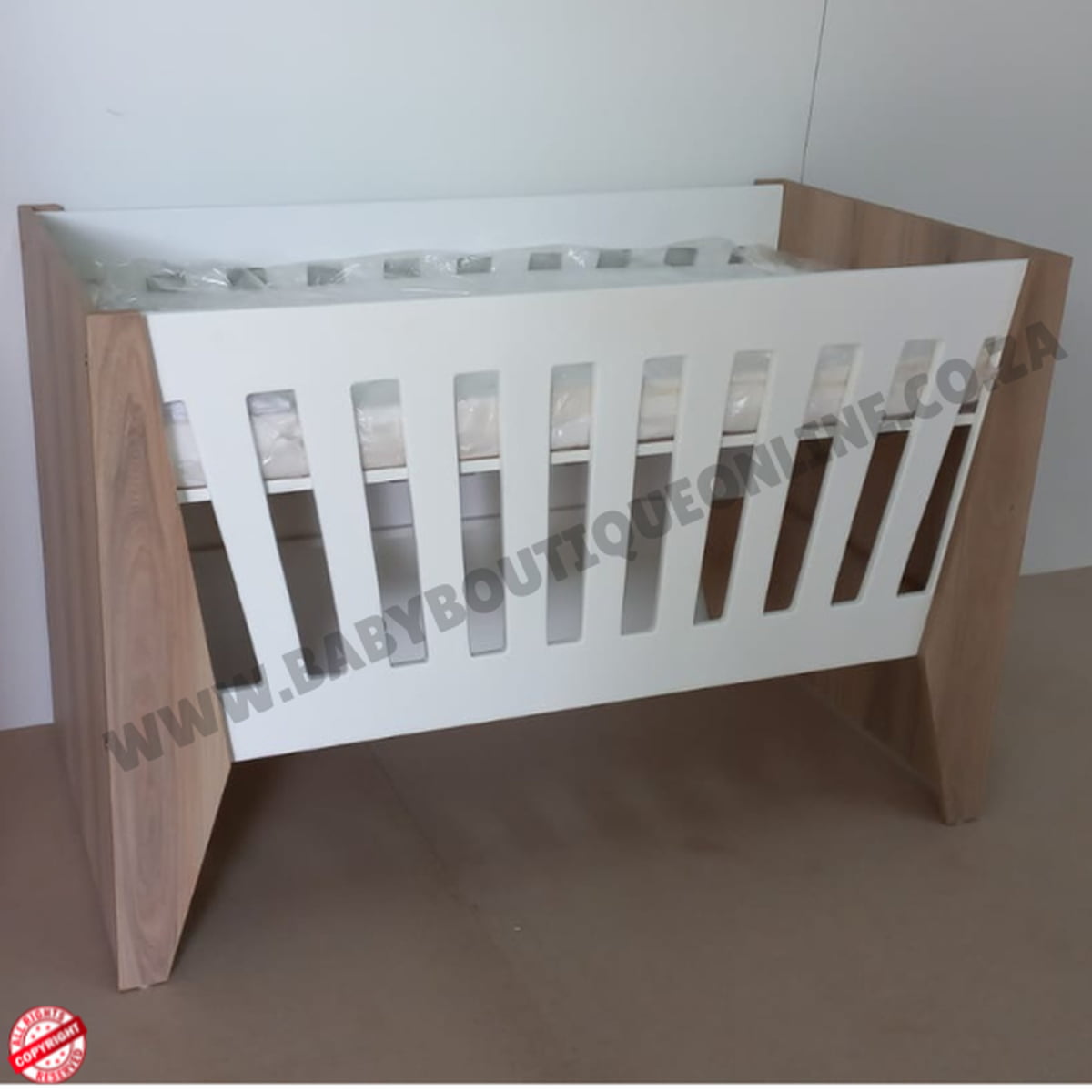 Emma Large Wooden Cot-White_Sahara Wooden crib with white mattress on a plain background