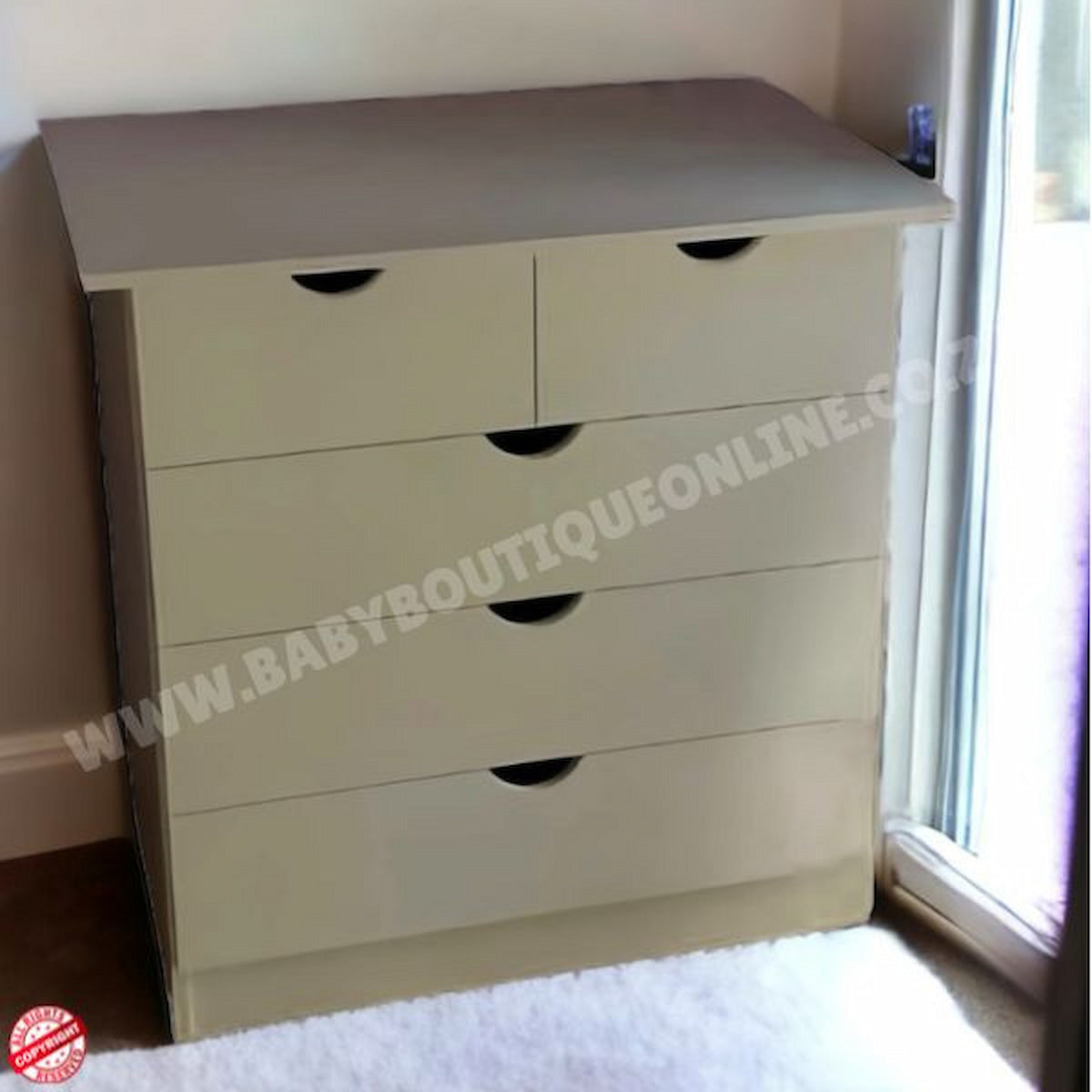 Beige dresser with multiple drawers in a room setting.