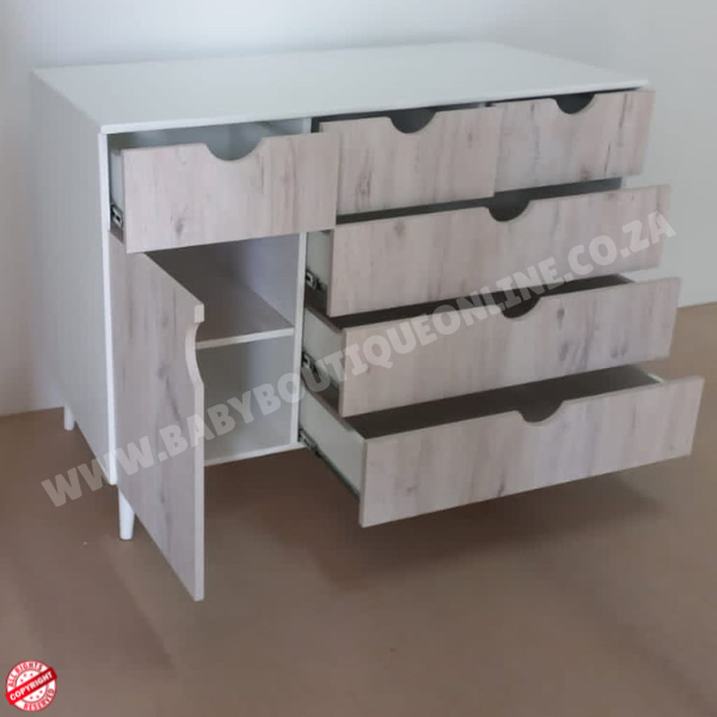 Wooden dresser with multiple drawers on a plain background