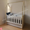 Tent Large Cot-White_OakSmoke with a house-shaped top in a room setting