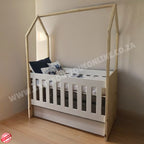 Tent Large Cot-White_OakSmoke with a house-shaped top in a room setting