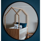 Tent Large Cot-White_OakSmoke with a house-shaped canopy and string lights, reflected in a circular mirror.
