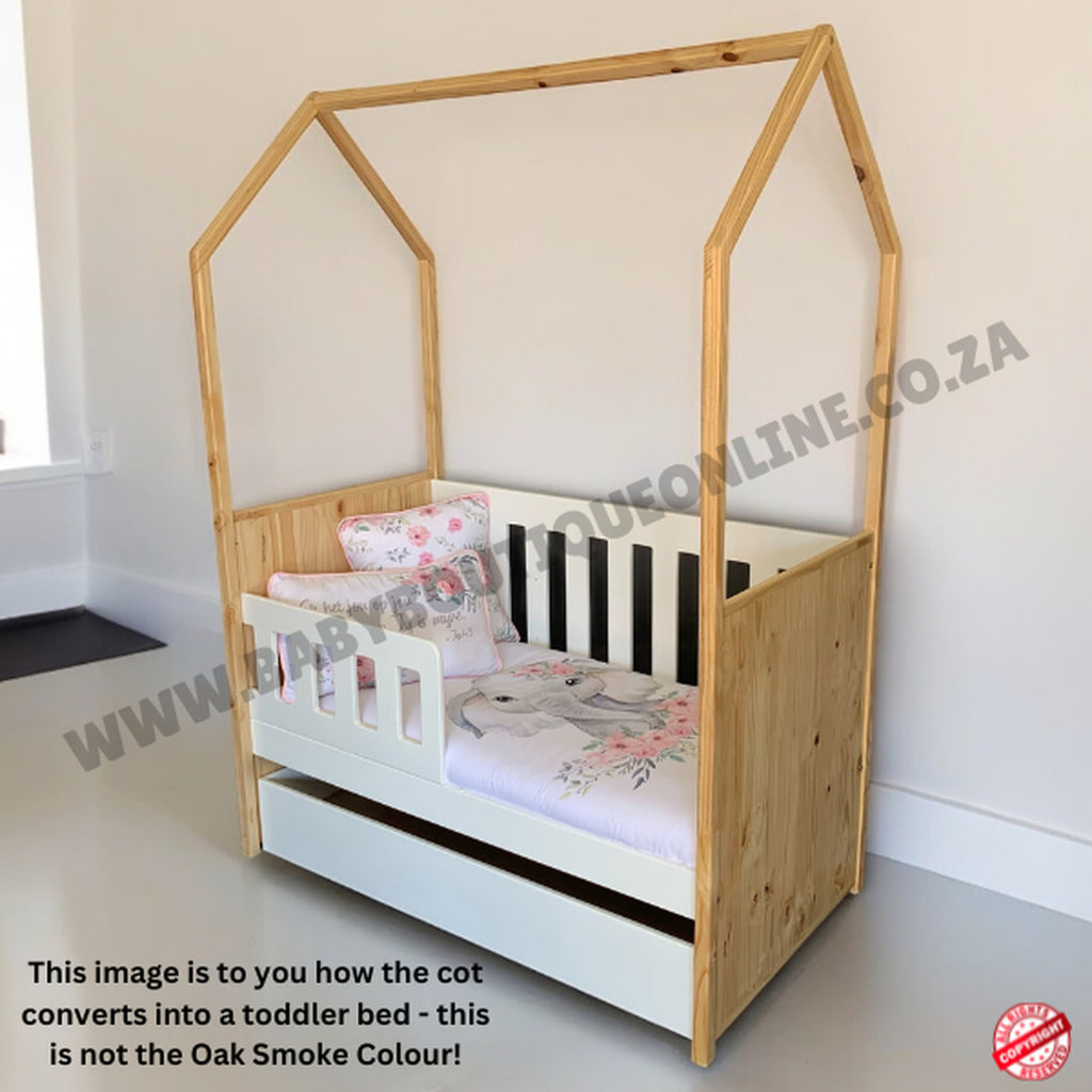 Tent Large Cot-White_OakSmoke with a house-shaped top, white mattress, and floral bedding on a light gray floor.