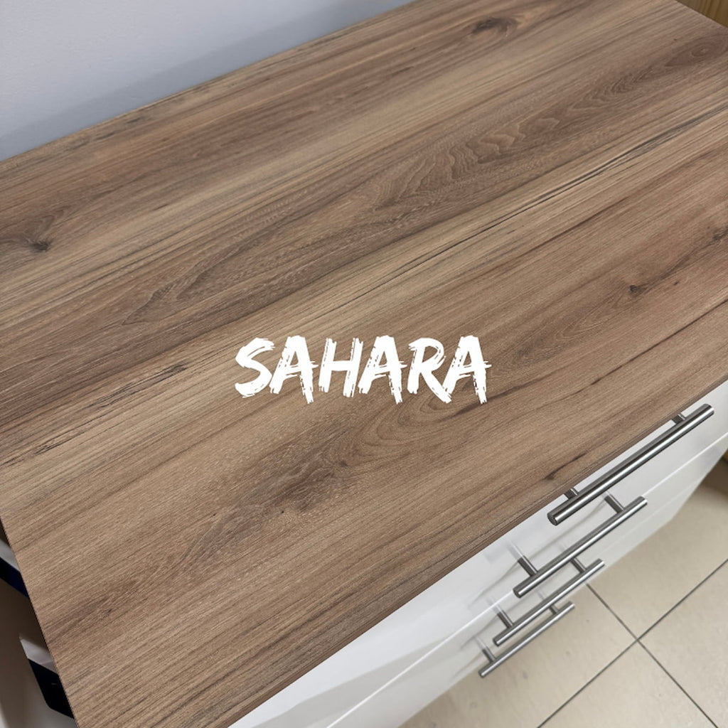 BabyBedroominaBox-5-in-1Cot Wooden surface with 'SAHARA' branding on a kitchen counter. 