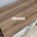 BabyBedroominaBox-5-in-1Cot Wooden surface with 'SAHARA' branding on a kitchen counter. 