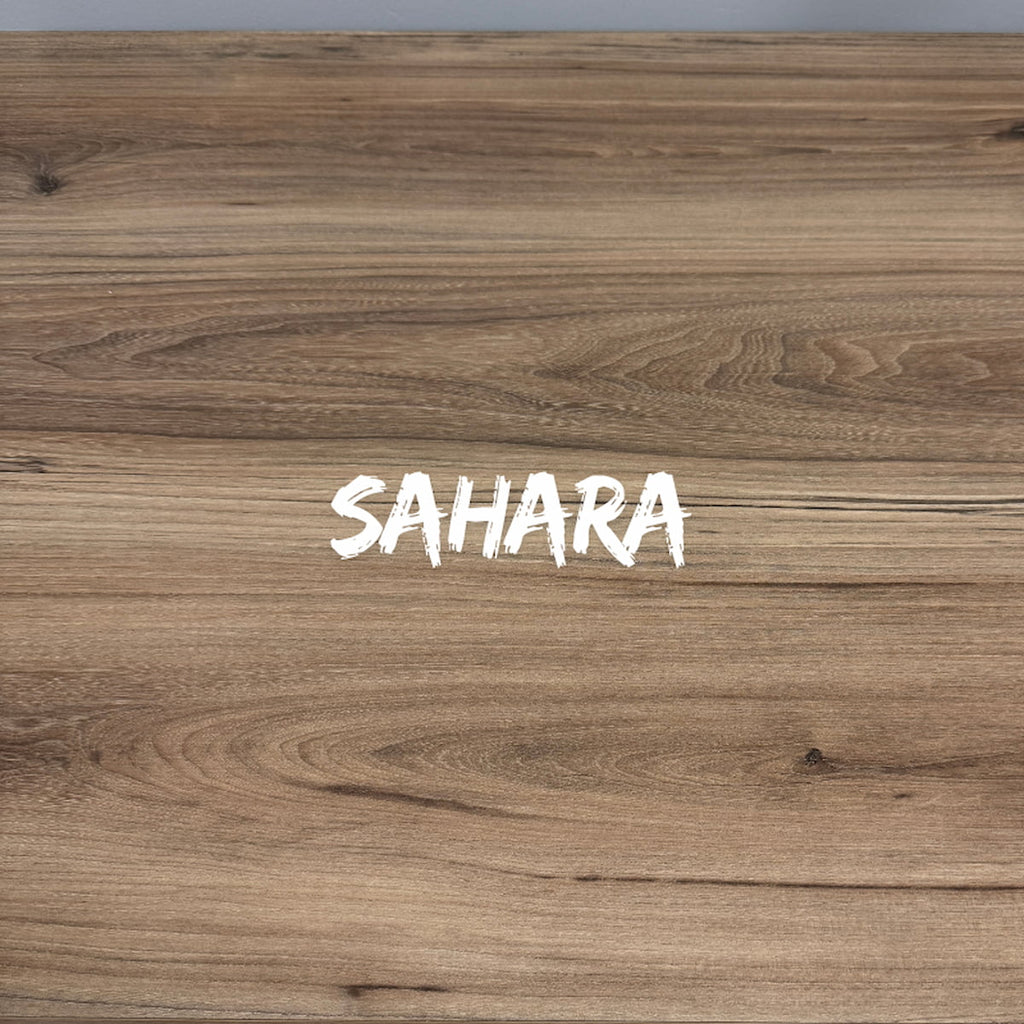 Wooden surface with 'SAHARA' text in white