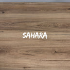 Wooden surface with 'SAHARA' text in white