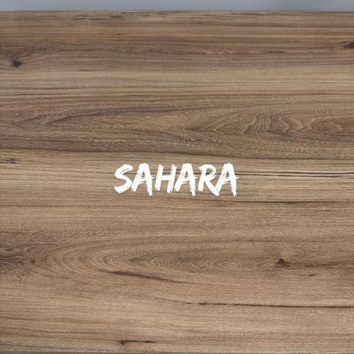 Wooden surface with 'SAHARA' text in white