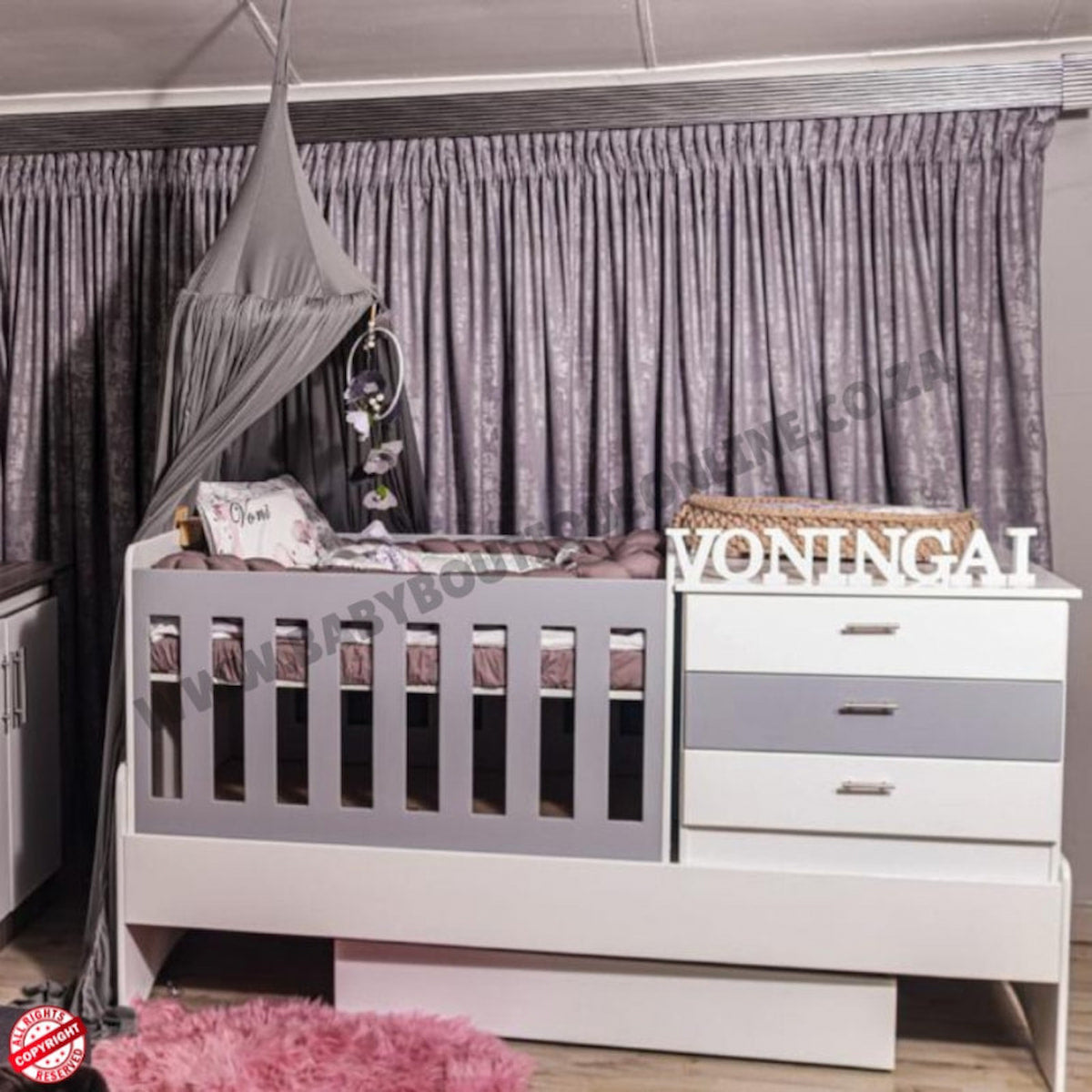 BabyBedroominaBox5-in-1Cot Nursery room with crib, changing table, and decorative elements.